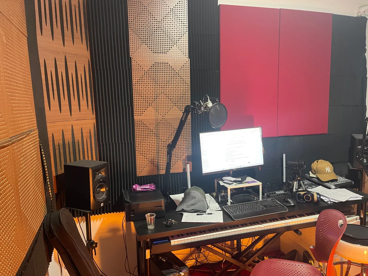 555 actual music and vocal production studio with keyboard, recording microphone and acoustic treatment